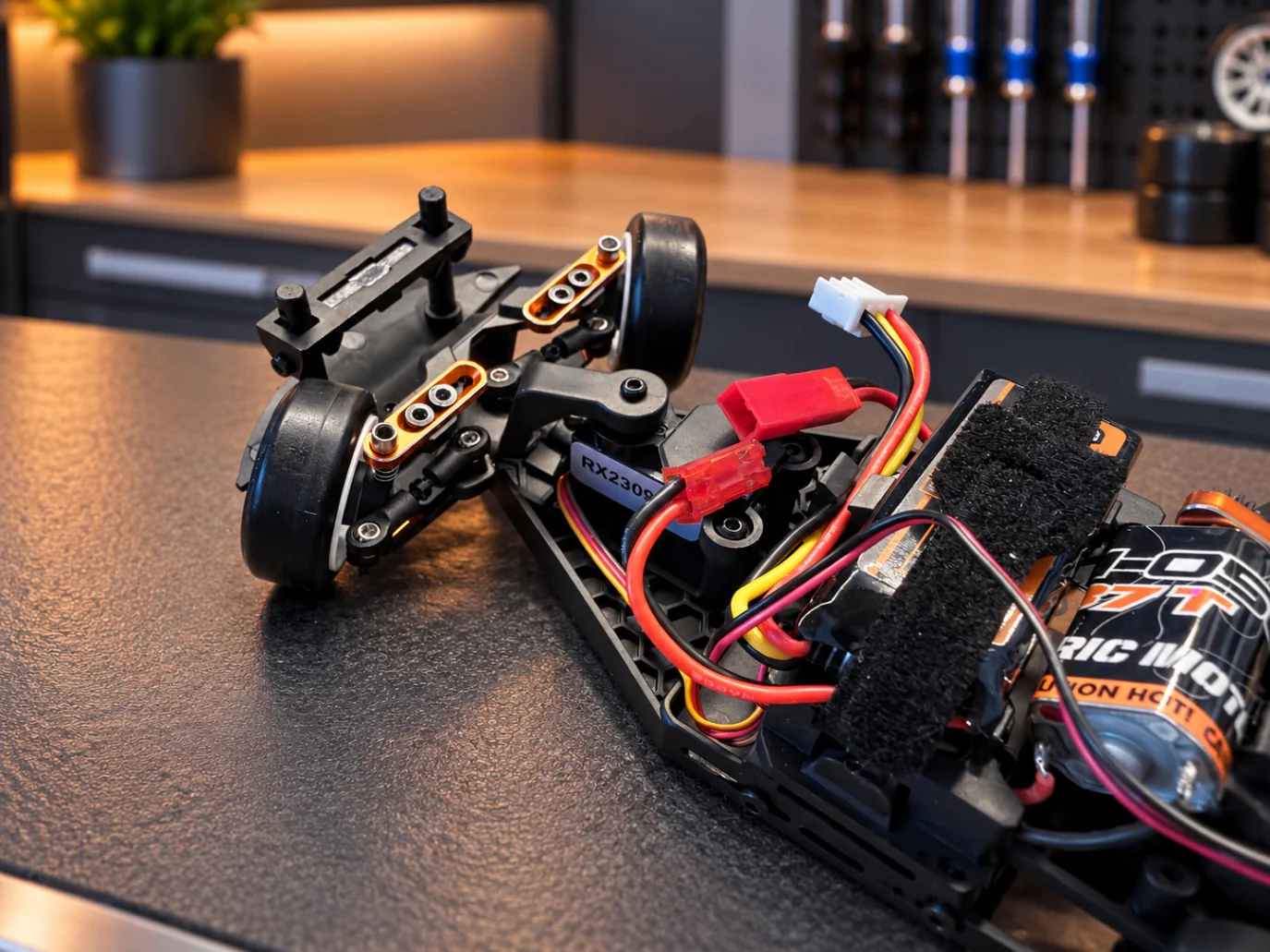 HPI Stage-D24 chassis detail showing drivetrain and wiring