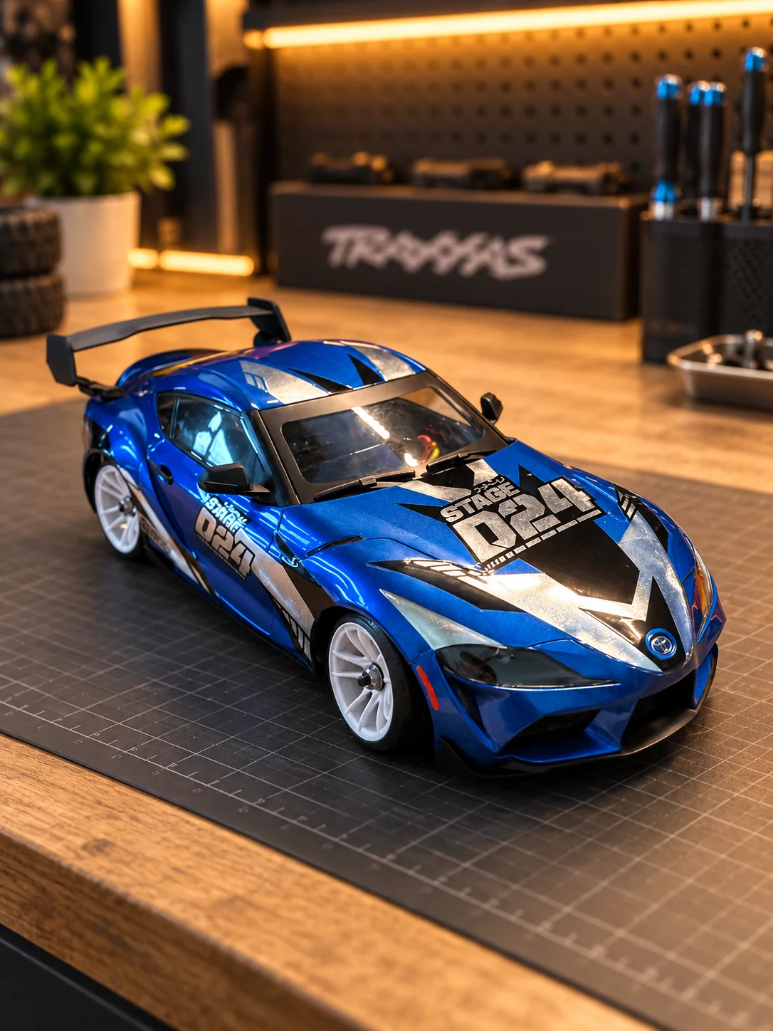 Blue HPI Stage-D24 Toyota GR Supra from the front in the workshop